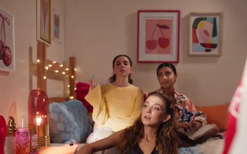 Friends gather in a dorm room in HomeGoods’ Back to Campus