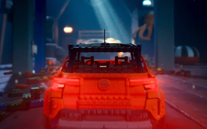 A red toy Opel Frontera built from bricks in Ready for Your Daily Adventures