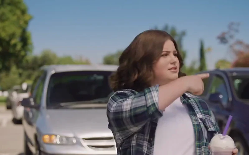 A woman gestures through an open car window in Volkswagen’s Unwritten Rules