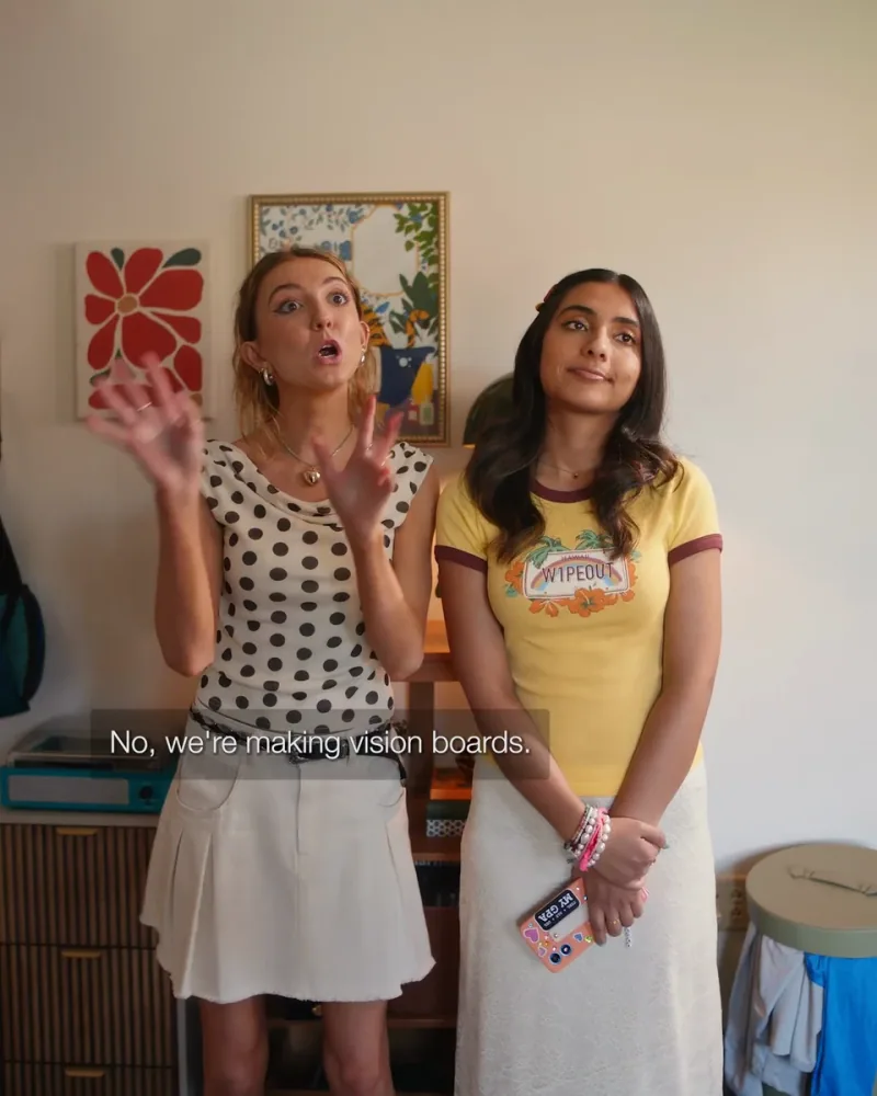 Two students in a dorm room gesture during a conversation in HomeGoods The Blanket
